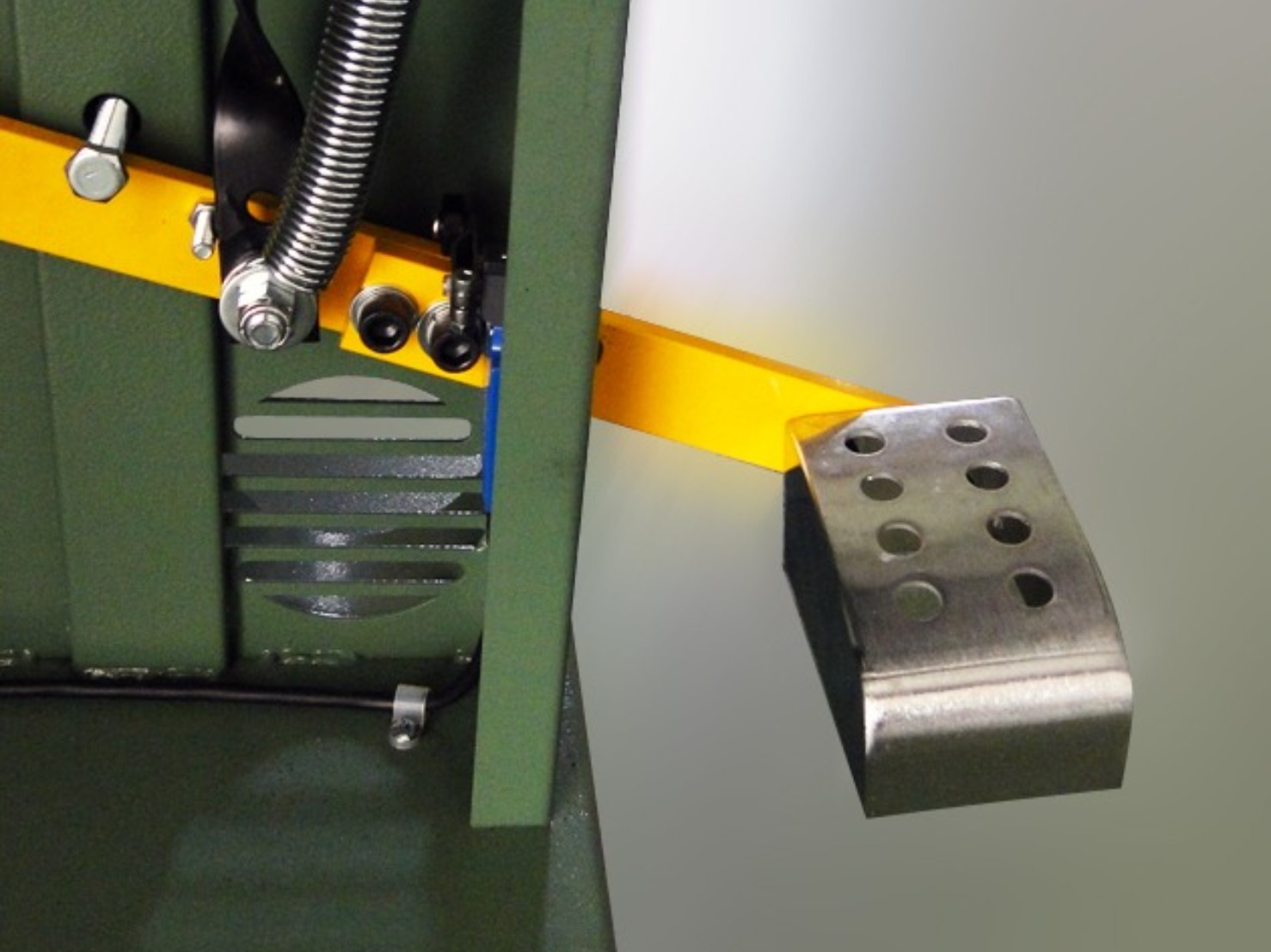 Foot brake system for wood cutting bandsaw